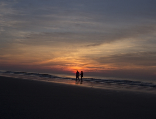 Couple Walking Down Beach